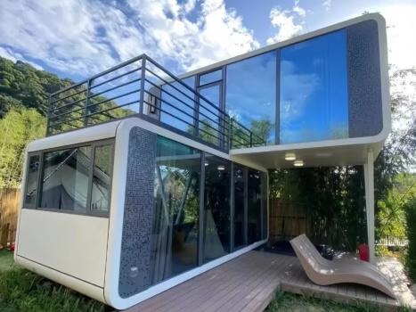 Manufacturer-supplied photograph of a two-level modular-space structure with large glazed openings