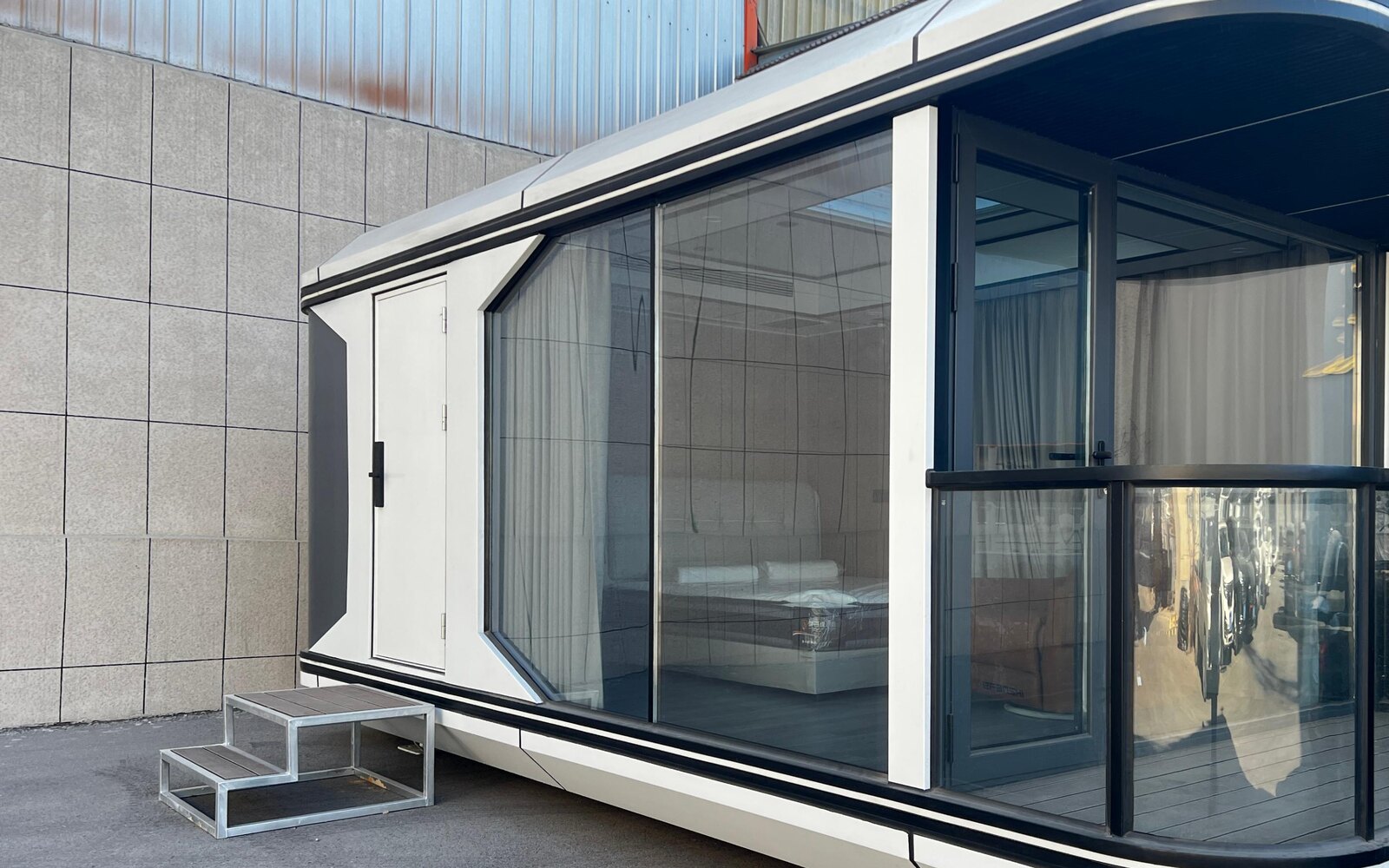 Manufacturer-supplied photograph of a modular unit with a covered exterior platform